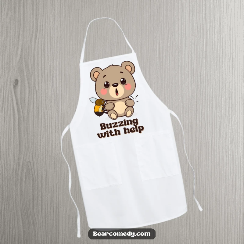 Funny apron print: A shocked bear is being lifted by a small bumblebee, a humorous kitchen accessory for any cook.