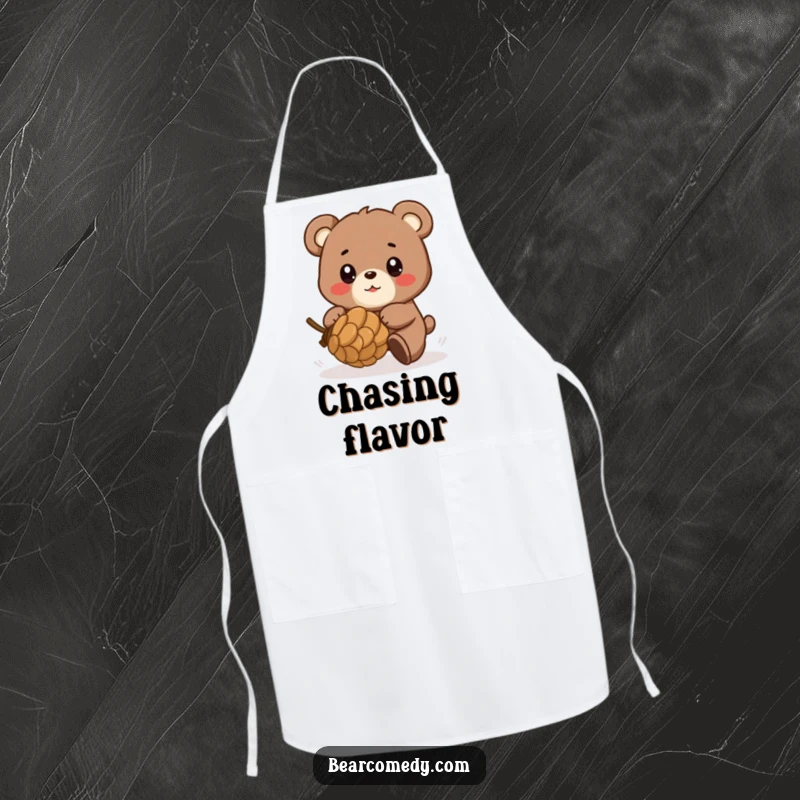 Funny apron showing a bear character playfully chasing a rolling pinecone with eyes full of glee, adding humor to kitchen tasks.
