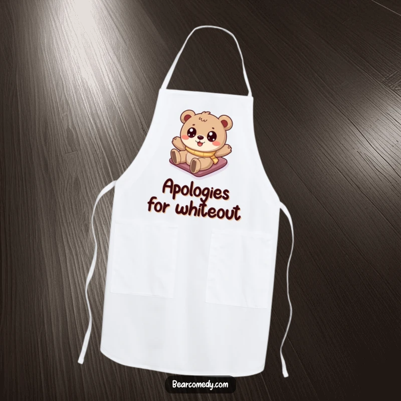 Funny bear apron showing a cartoony bear with big eyes sliding down a snowy hill, bringing winter fun to the kitchen.