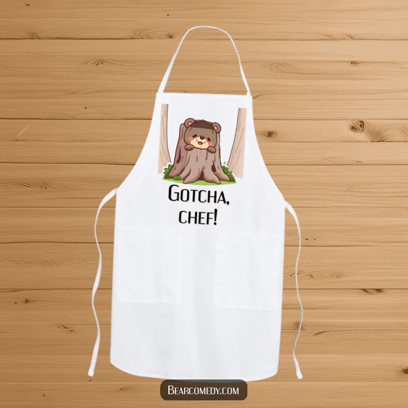 Funny bear apron showing a bear peeking from behind a tree stump with a mischievous, funny grin, perfect for kitchen humor.