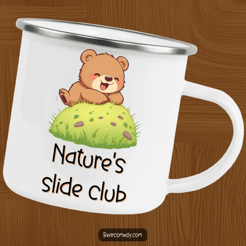 Funny camping mug featuring a bear cub joyfully rolling down a grassy hill, perfect for enjoying hot beverages during outdoor escapades.