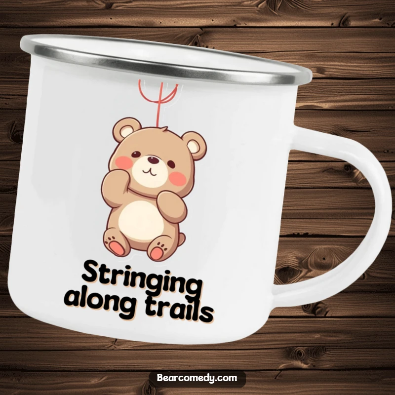 Funny bear camping mug showing a playful bear character batting at a bright, dangling string, ready for playtime.