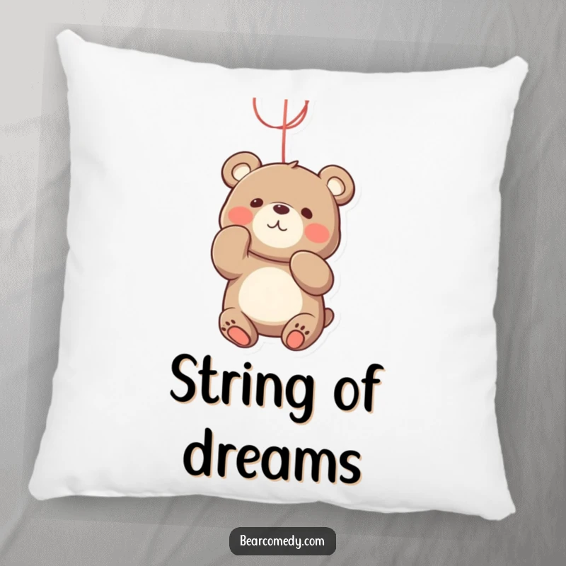 Funny bear pillow featuring a playful character batting with its paws at a bright, dangling string, embodying pure fun.