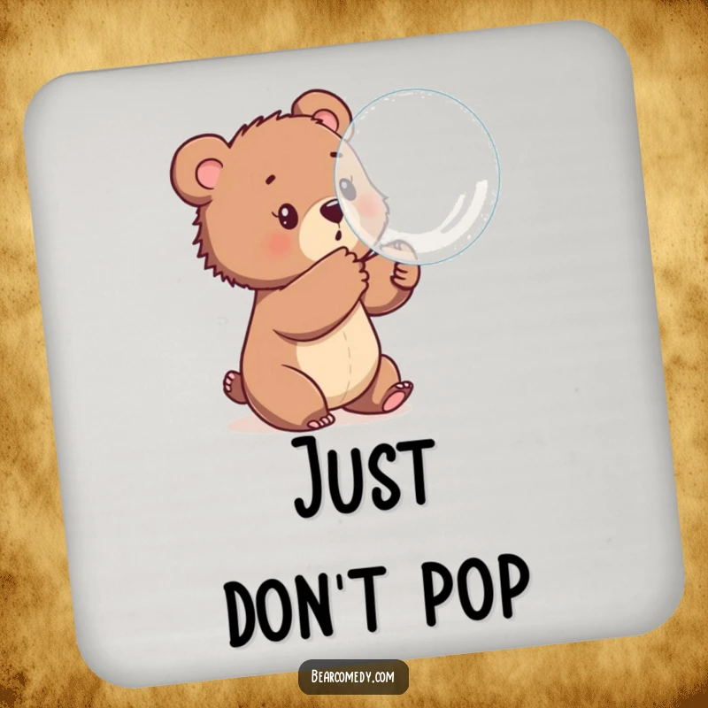 Funny drink coaster with a bear cub playfully batting at a large bubble, adding a fun and protective touch to beverage service.