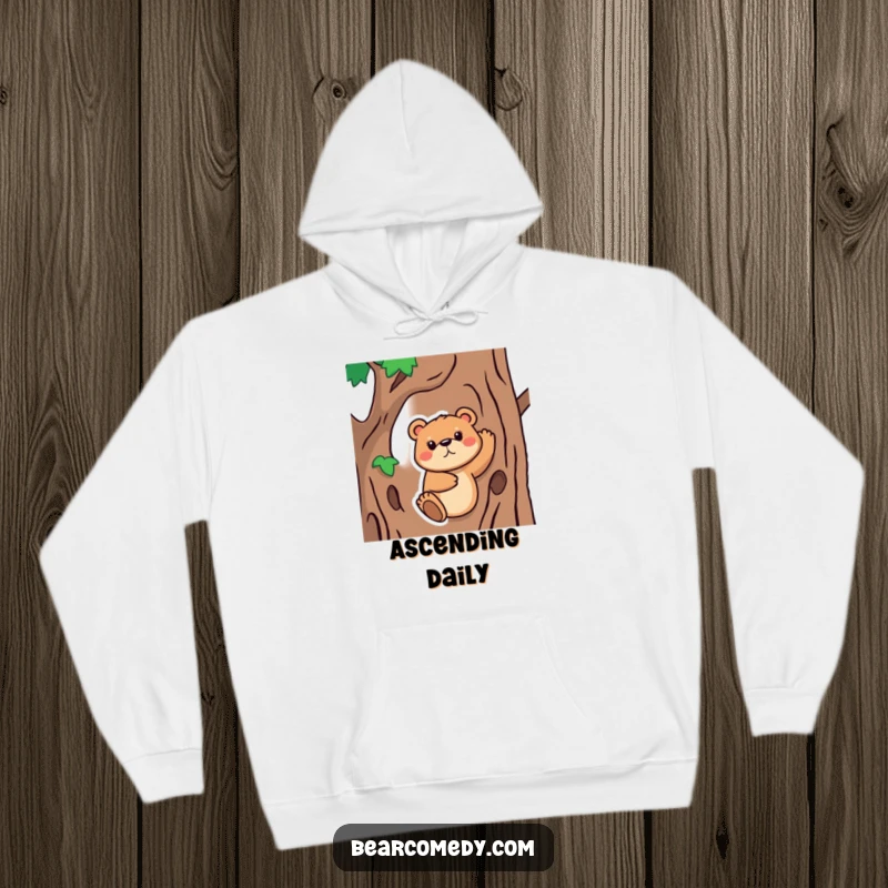 Funny Hoodie showing a bear animal with a determined face, attempting to climb a tree, offering cozy comfort with a dose of humorous perseverance.