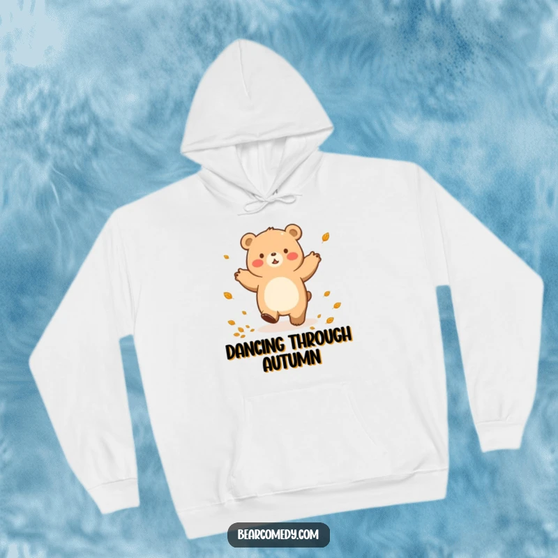 Funny hoodie illustration of a bear character enjoying a happy lumbering dance, surrounded by a shower of autumn leaves.