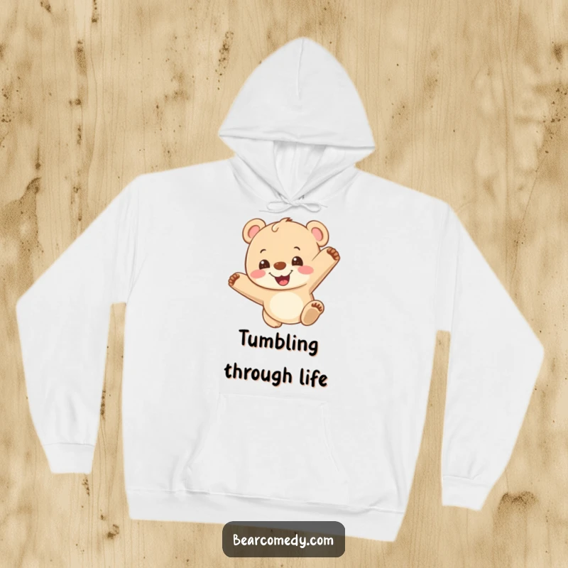 Funny hoodie featuring a grinning bear cub in mid-somersault, radiating playful energy and infectious happiness, perfect for active days.