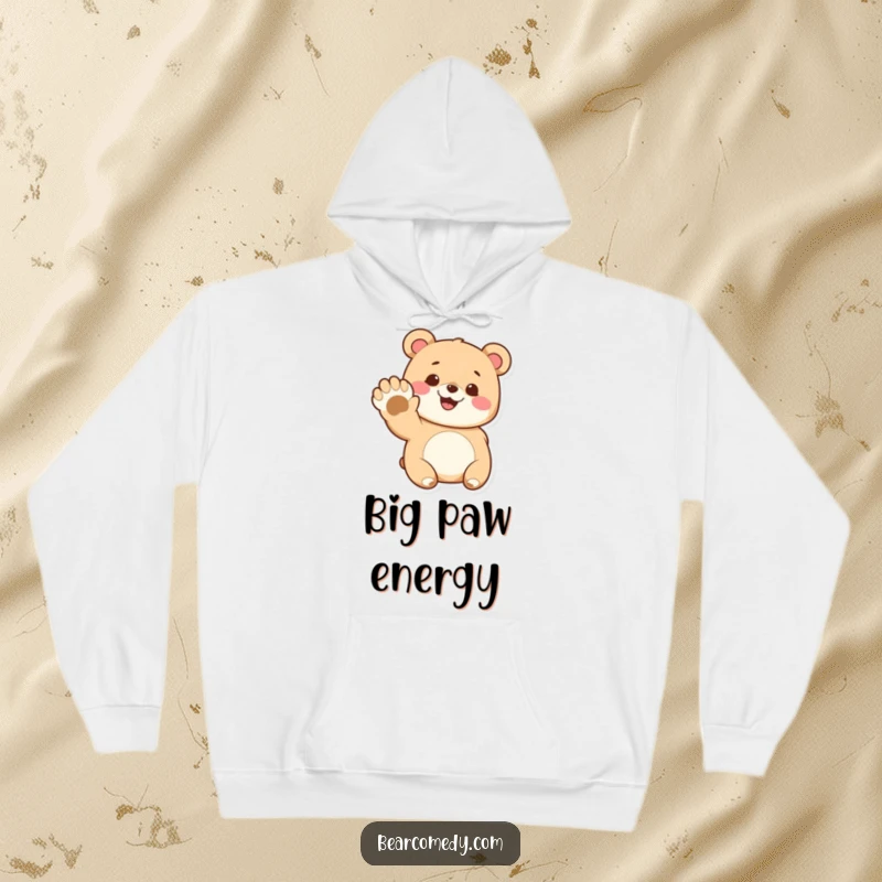 Funny hoodie featuring a plush bear character with a wide grin, waving its giant paw in a friendly gesture.