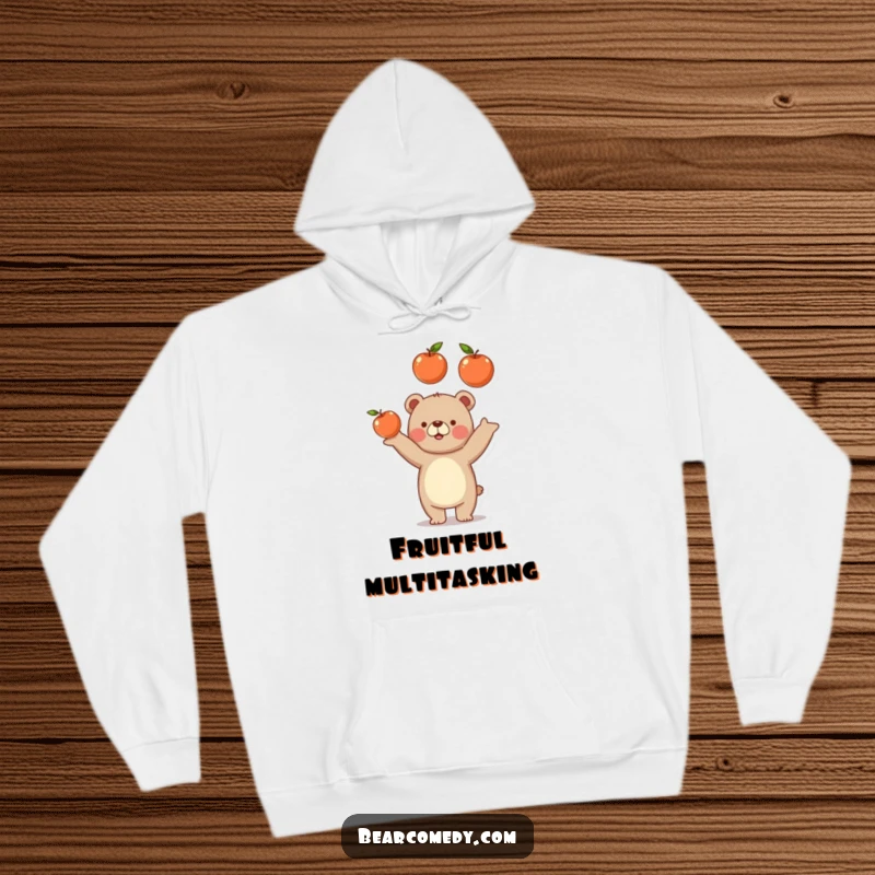 Funny bear hoodie showcasing a gleeful bear juggling three round, juicy apples, perfect for cozy, humorous moments.
