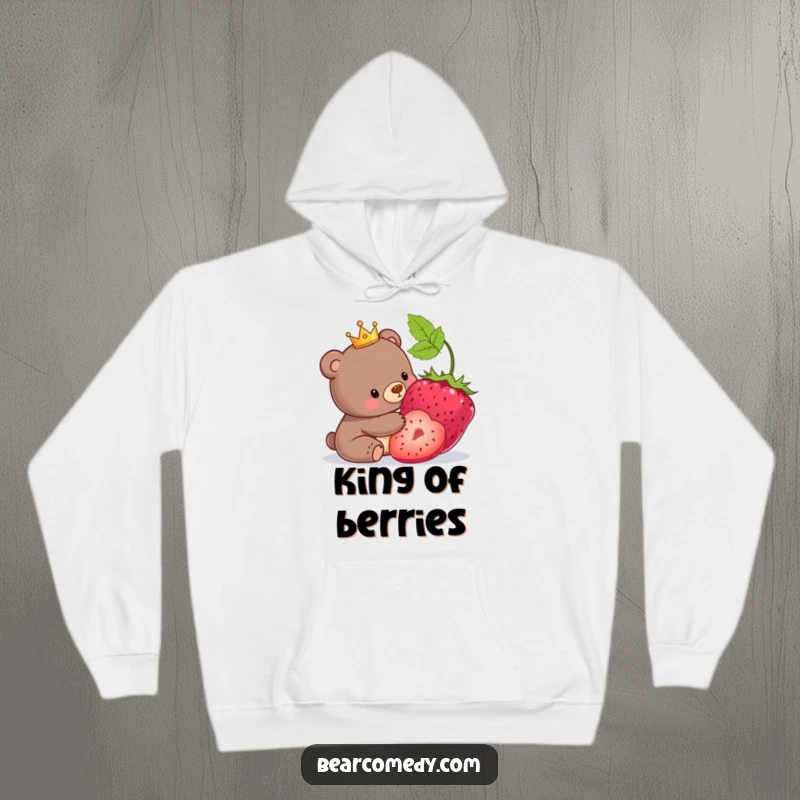 Funny hoodie featuring a bear wearing a small crown, gently nudging a comically large berry.
