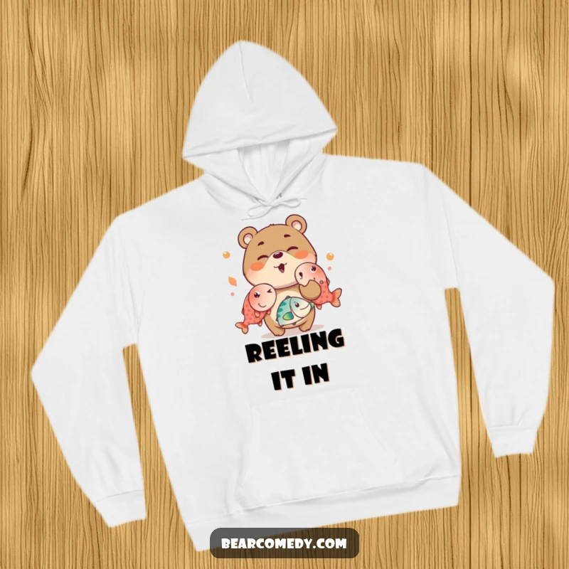 Funny hoodie featuring a mischievous bear charactere winking while juggling oversized, bright fish, offering warmth and humorous style.