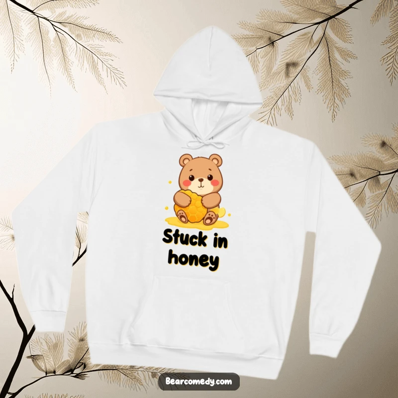 Funny hoodie depicting a round bear character with a big smile, giving a massive honeycomb a warm, loving hug.