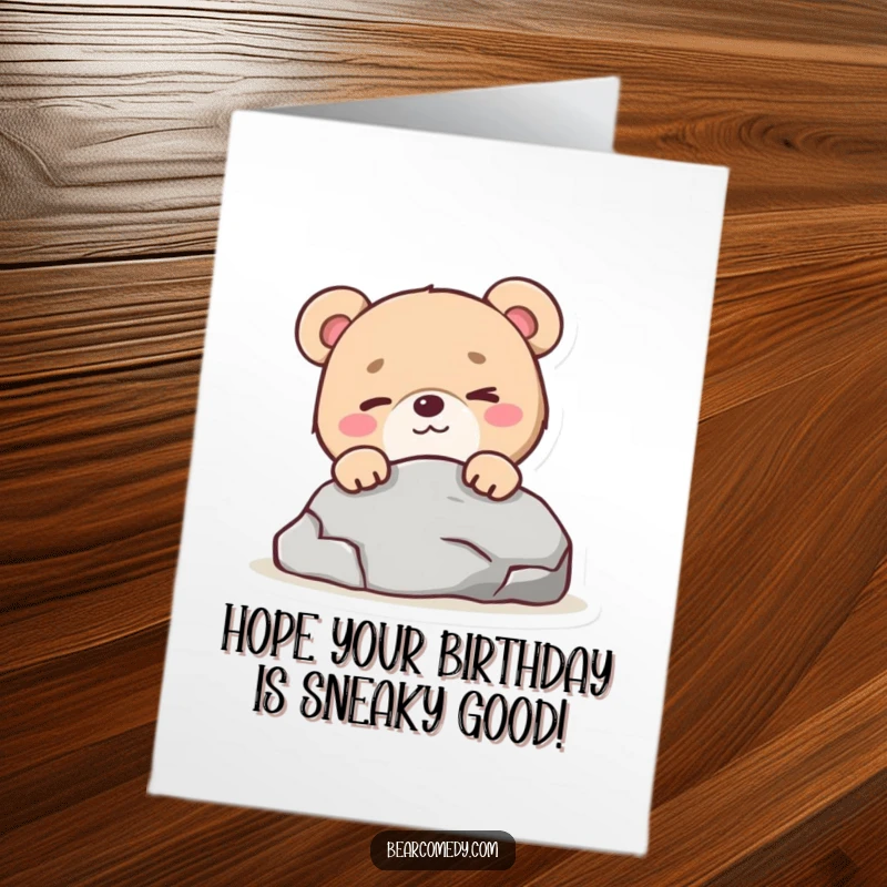 Funny Free Printable Birthday Card: A mischievous bear character winks playfully while peeking from behind a rock, adding birthday fun.