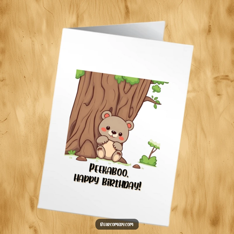 Funny Free Printable Birthday Card: A bear with curious paws peeks from behind a giant, friendly tree, ready to wish happy birthday.