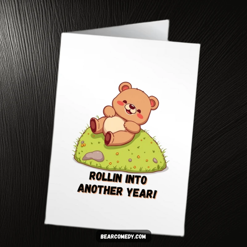 Funny Free Printable Birthday Card: A joyful bear creature gleefully rolling down a grassy hill, spreading birthday cheer.