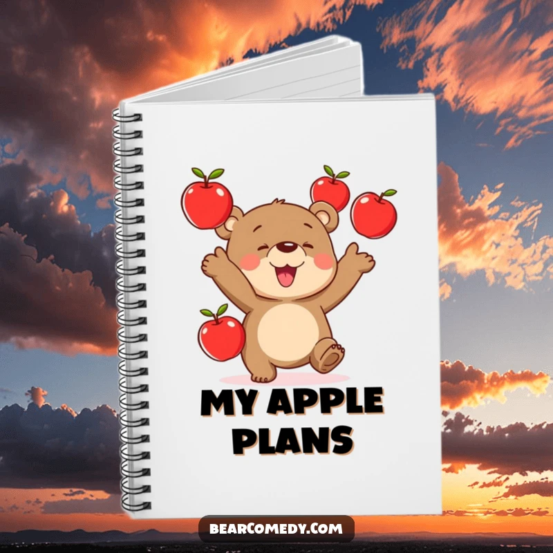 Funny notebook cover showing a bear character gleefully juggling three red apples, ideal for capturing creative sparks.