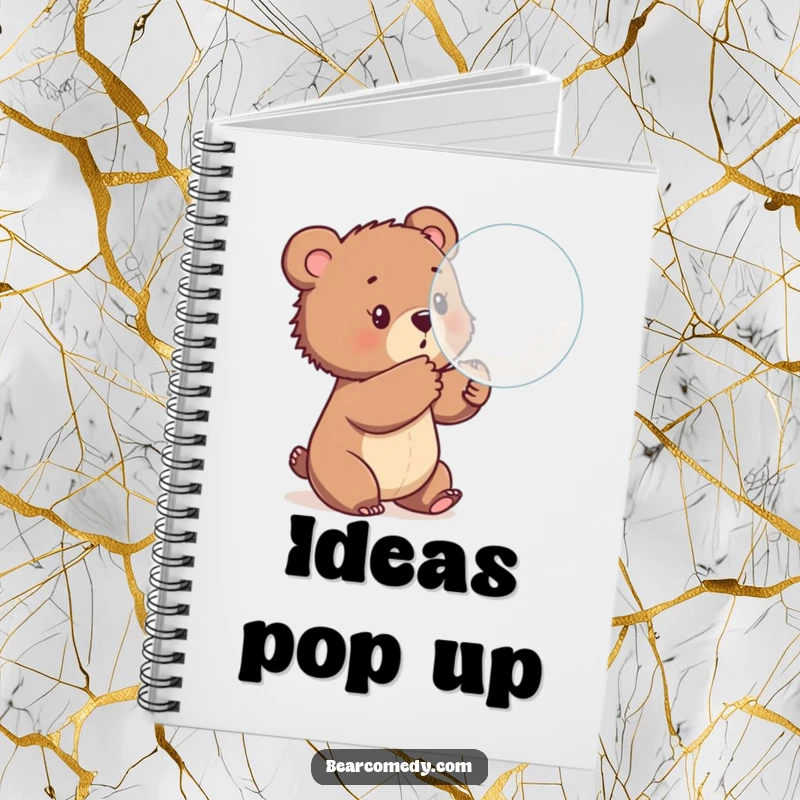 Funny notebook cover showing a bear cub playfully batting at a large bubble, symbolizing carefree thoughts and imaginative ideas.