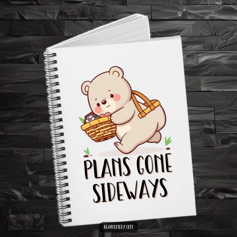 Funny notebook with a playful bear character comically tripping while carrying an oversized picnic basket, ready for notes.