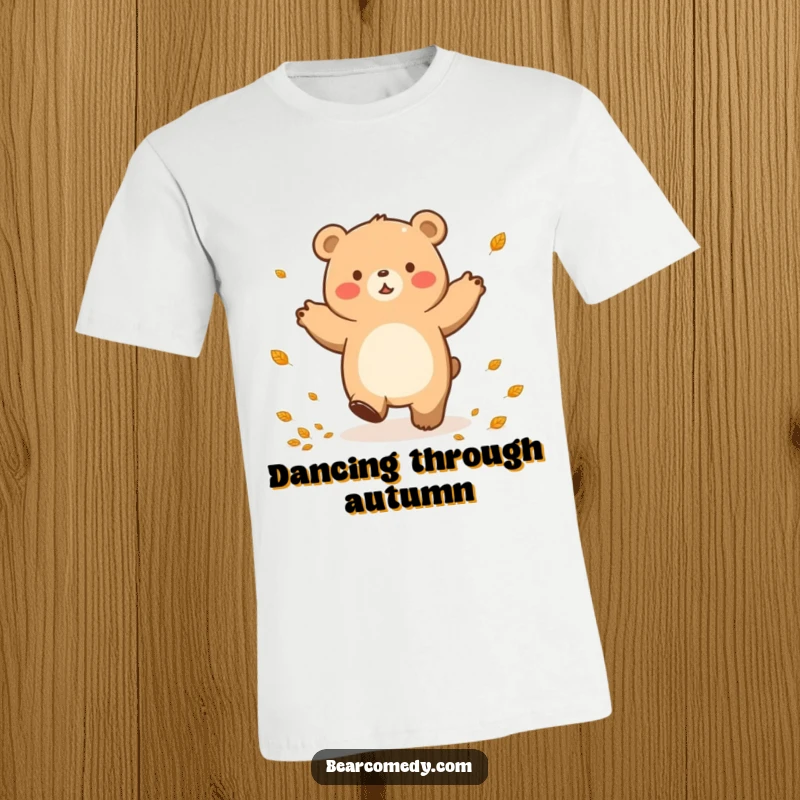 Funny t-shirt featuring a bear character in a happy lumbering dance, with small leaves swirling joyfully around it.