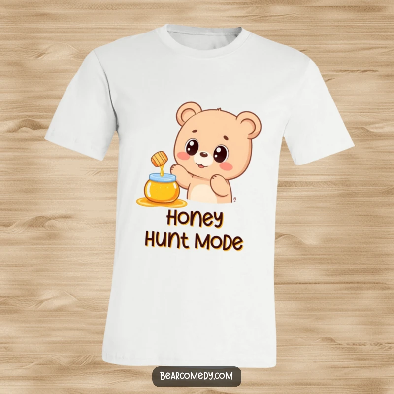 Funny t-shirt featuring a kawaii bear with wide, ecstatic eyes reaching for a delectable floating honey pot, expressing sweet longing.