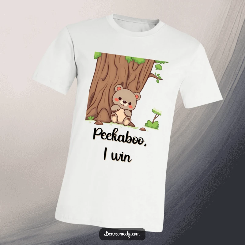 Funny bear t-shirt showing a bear with inquisitive paws peeking out from behind a large, welcoming tree, full of wonder.