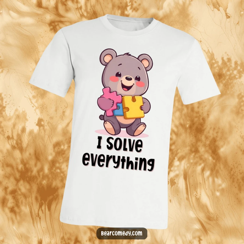 Funny bear t-shirt showing a happy bear character balancing a tall stack of colorful, interlocking puzzle pieces with a grin.