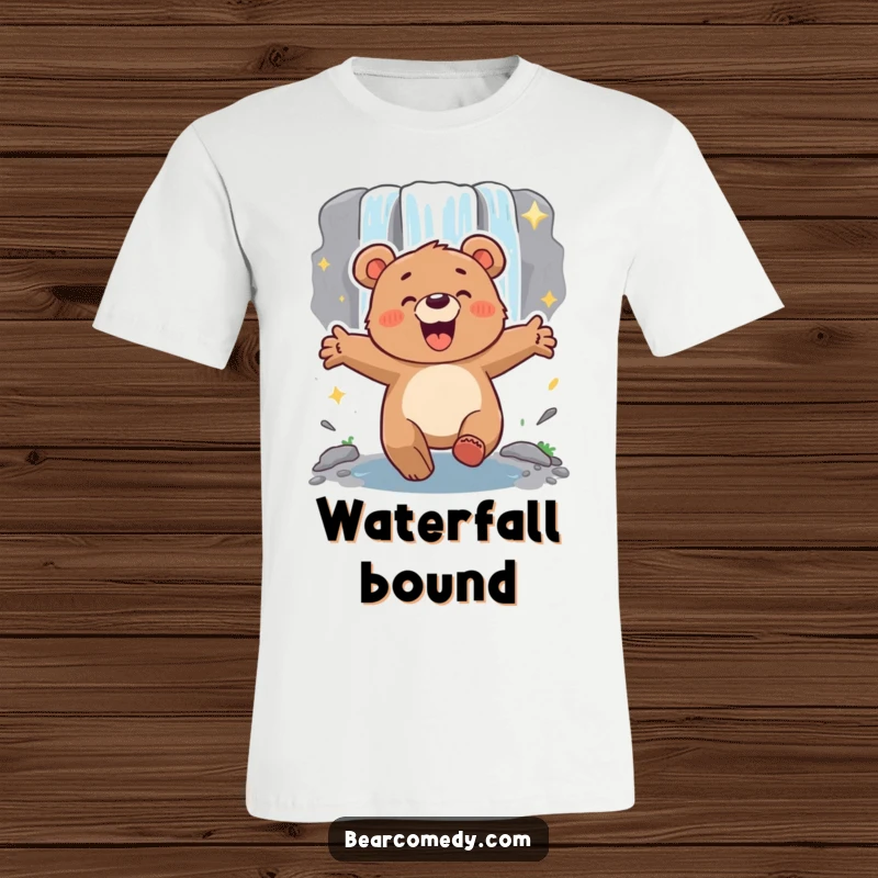 Funny energetic bear with arms outstretched, lumbering excitedly towards a sparkling waterfall, printed on a comfortable shirt.