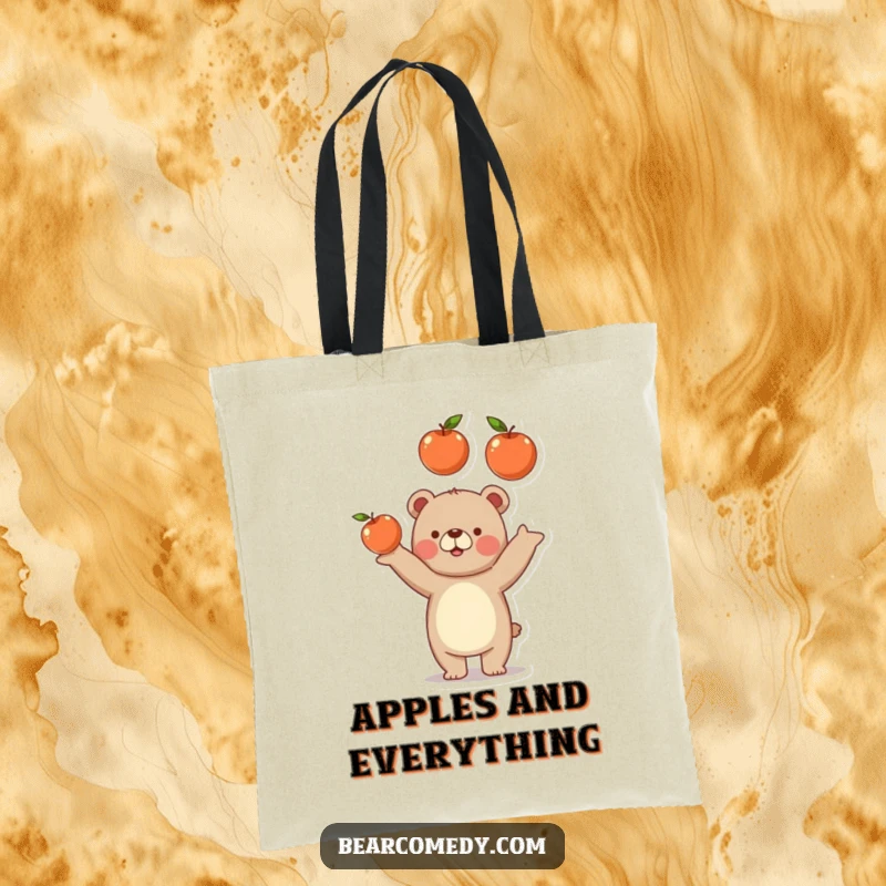 Funny bear tote bag with a bear playfully juggling three delicious apples, a humorous accessory for shopping.