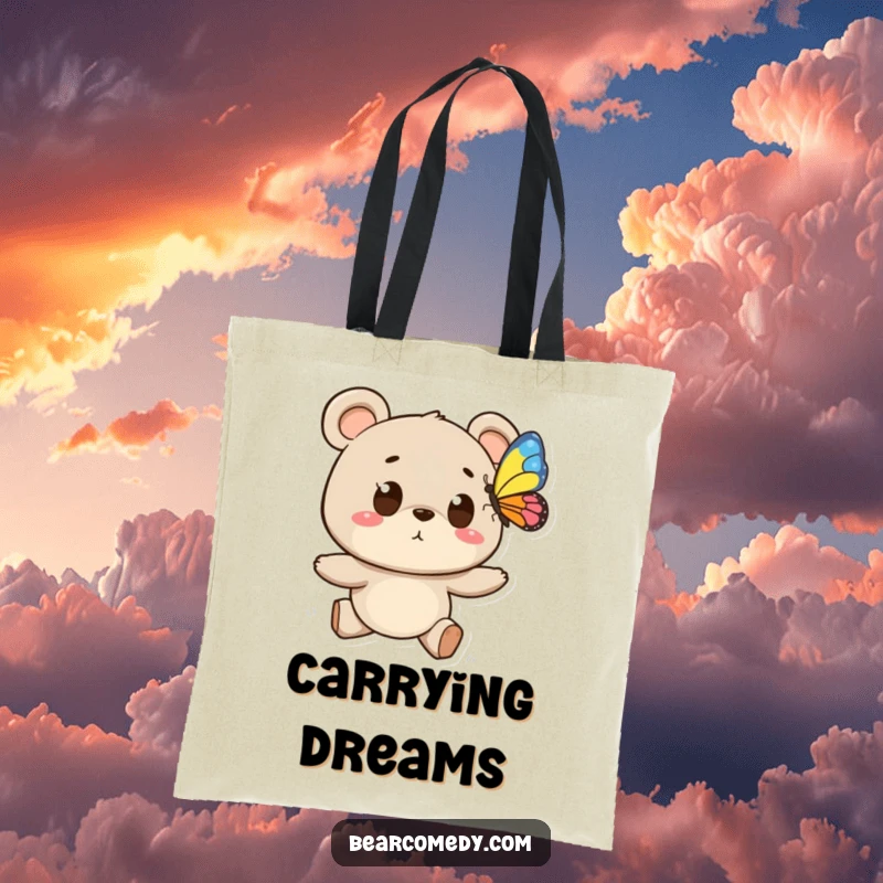 Funny tote bag featuring a bear character with wide eyes chasing a colorful butterfly, perfect for carrying items with whimsical flair.