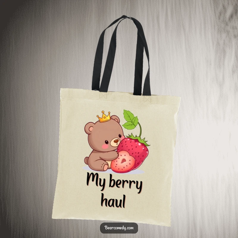 Funny tote bag with a bear wearing a tiny crown playfully nudging a massive berry.