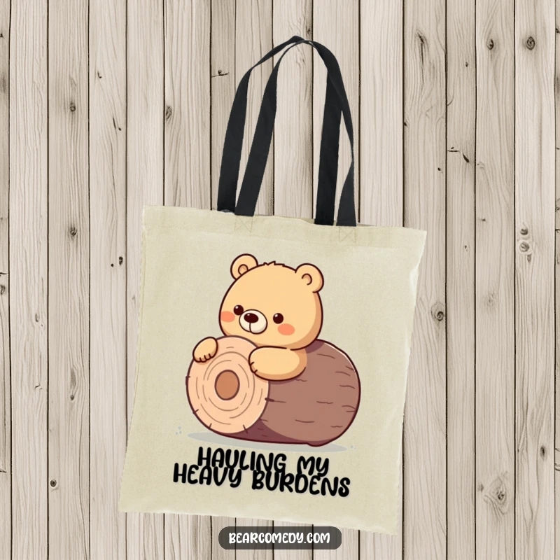 Funny tote bag showing a bear character giving a determined nudge to roll a giant, round log.